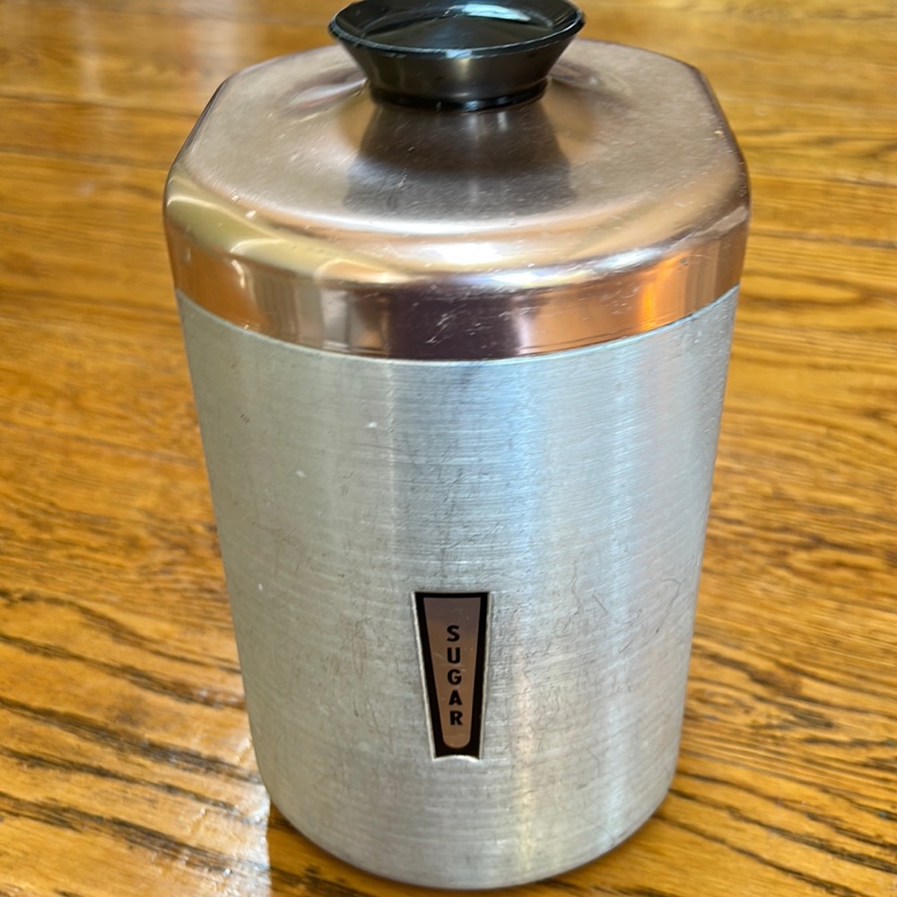 Vintage spun aluminum sugar canister, silver with copper color lid.